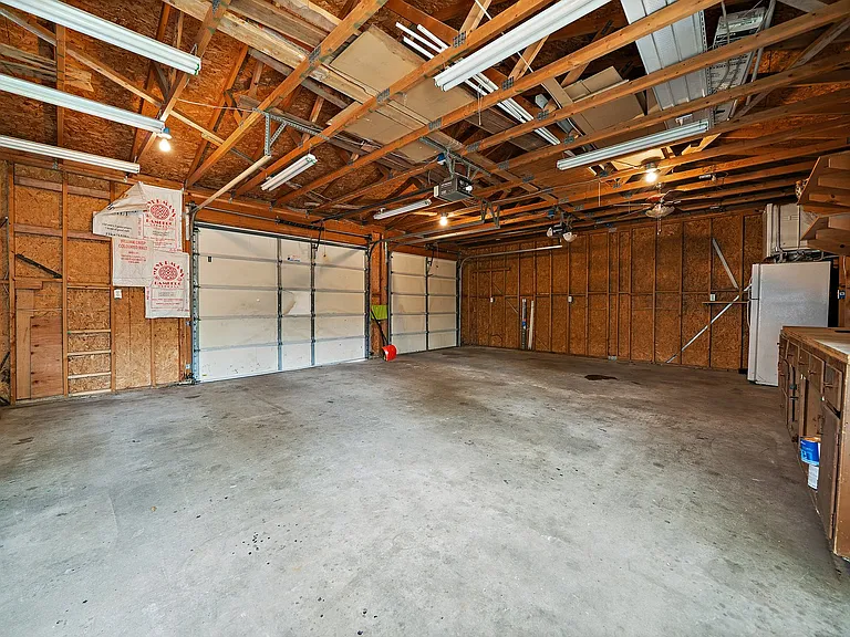 Left most garage door space is for upper unit. Extra shared storage in garage.