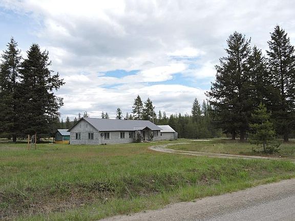 DISTANT VIEW OF HOUSE FROM COUNTY ACCESS ROAD SHOW