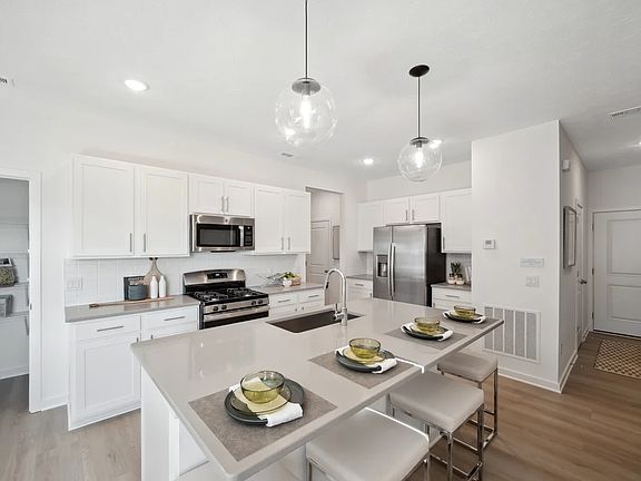 Kitchen with island and pendant lighting