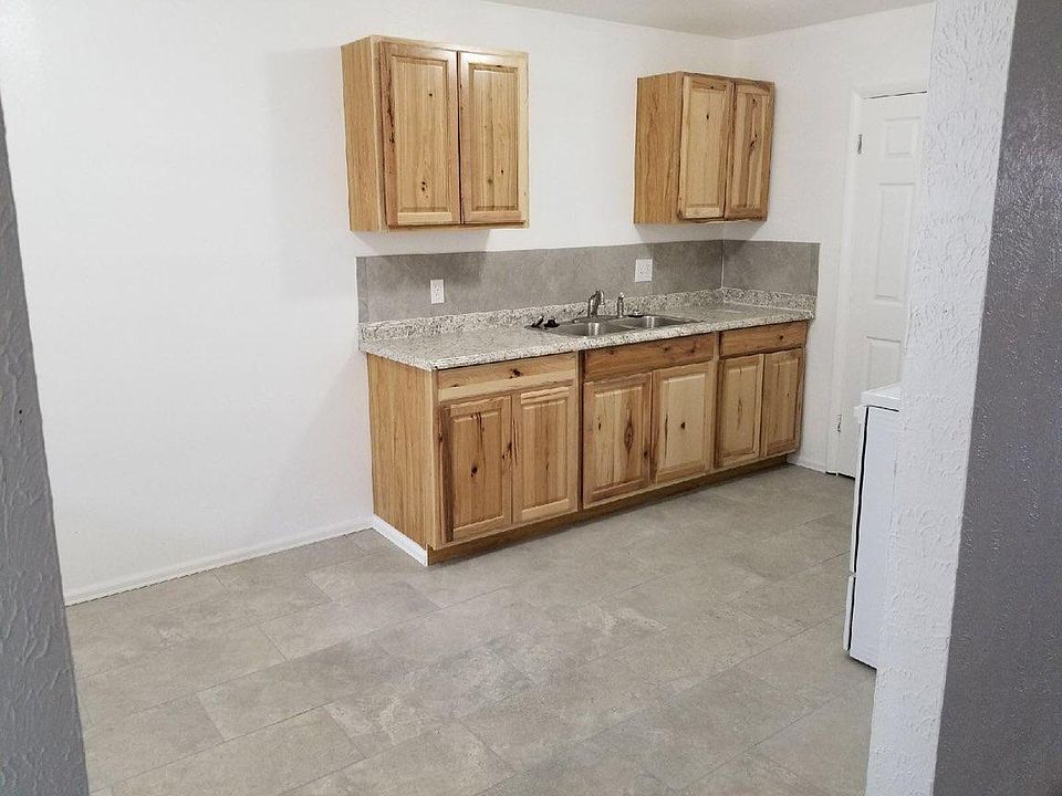 Totally remodeled kitchen with new cabinets and tiled floor
