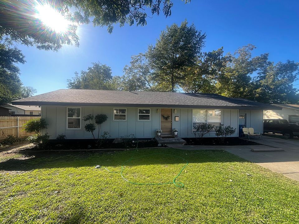 Gorgeous board and batten exterior painted in the currently trending robin's egg blue. Be prepared to watch the roses bloom out the living room window in the Spring.