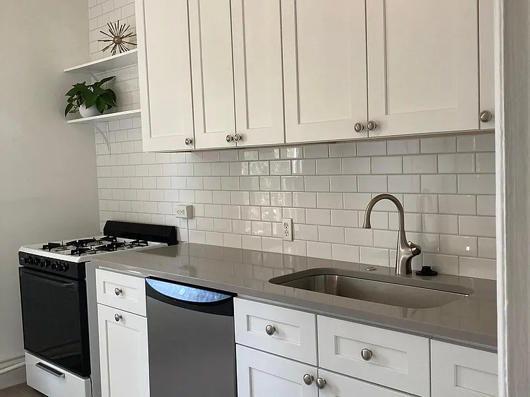 New kitchen... subway tile backsplash, new tile floors, new cabinets, sink, counter tops. Really a beautiful space.