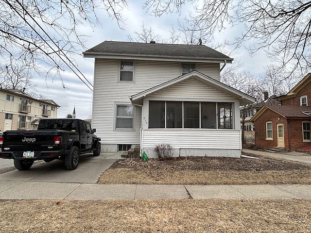 Front of home. Parking spot is located where black vehicle is in picture. Screened in front porch.