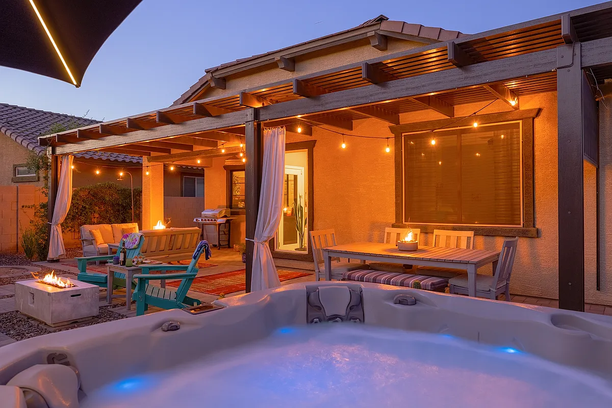 The backyard is an oasis, especially when the stars come out. Enjoy moonlit dinners, stargazing by the fire pit, or soak in the hot tub and look up. - S Loback Ln