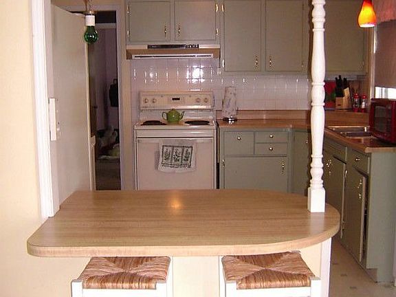 Kitchen through breakfast bar