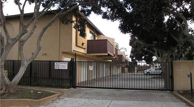 upstairs corner unit with two dedicated parking spots with gated access
