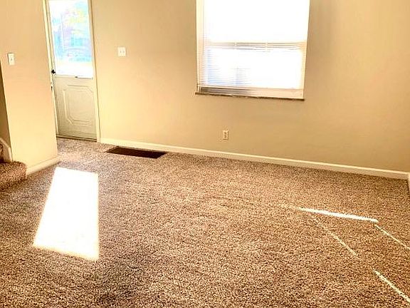 View of Living Room and Front Door from Dining Room