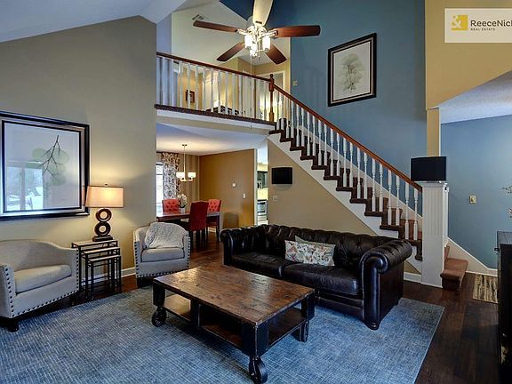 Warm & Inviting family room with planked hardwood and vast vaulted ceilings.