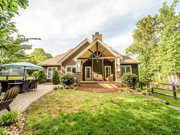 Home features craftsman style, natural stone columns, porches, and hardy-plank siding. Enjoy your own private oasis on 0.6 acres. Grill your favorite foods and entertain guests on the spacious stone-paver patio. Roast marshmallows over the built-in fir