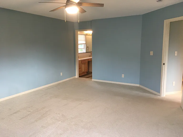 Master bedroom is upstairs. This space is huge - not all of it is shown in the photo. Has a connected full bath and walk in closet.