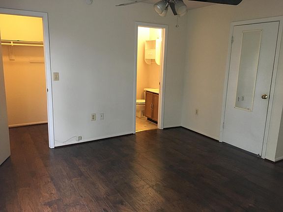 Master bedroom with master bathroom and walk-in closet