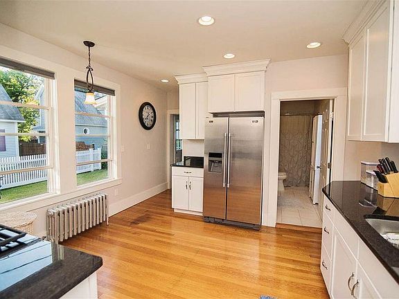 Kitchen. Mudroom and full bathroom in background.
