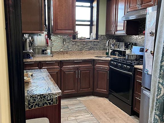 Custom cabinets and new crystal back splash, new tiling.