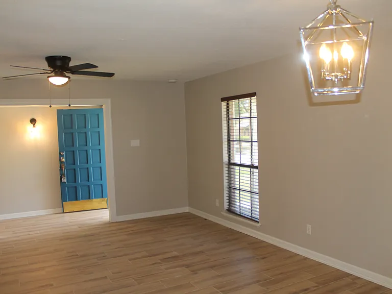 A spacious, versatile room just off the entry, perfect for a formal dining or living area