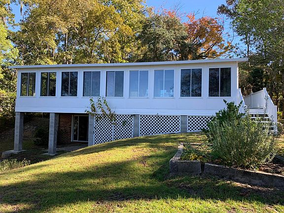 Sunroom on back of house over covered porch.