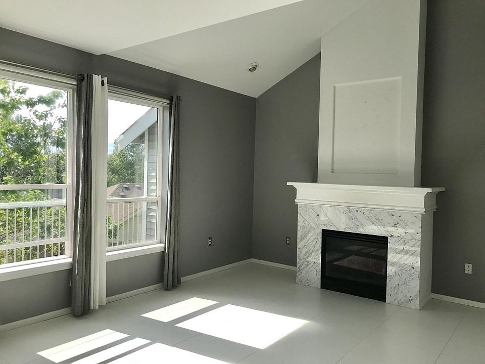 Warm and open living space with gas fireplace.