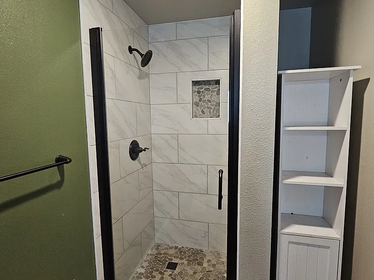 Custom tile shower in the lower level bathroom.