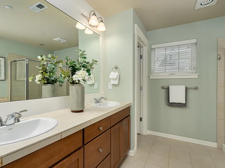 Primary en-suite with dual sinks, soaking tub and separate shower.