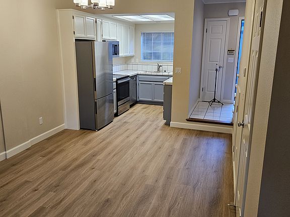 Spacious living room. Great for entertaining. Overflow on to the private patio