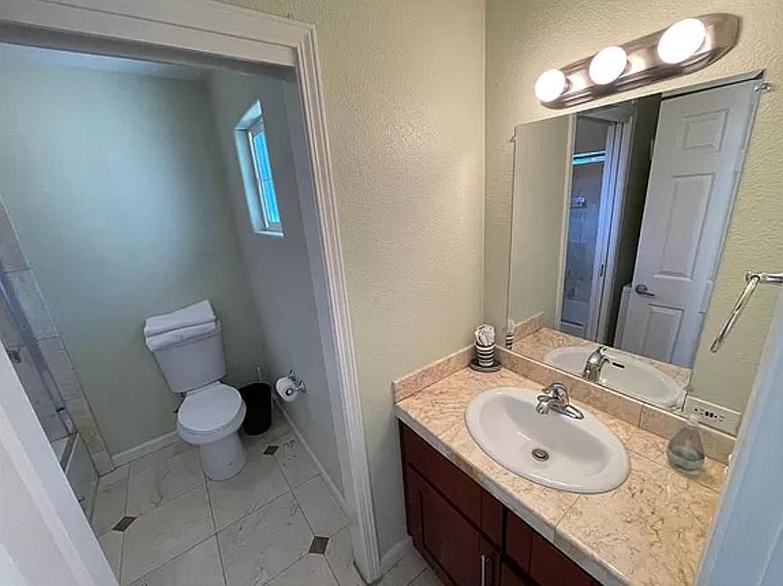 Light and beautiful bathroom with separate shower and toilet
