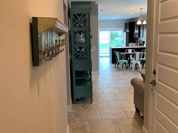 Entryway with garage door on right.