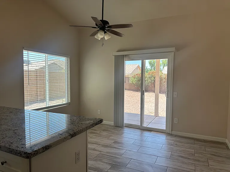 The dining area leads to the covered patio and backyard.