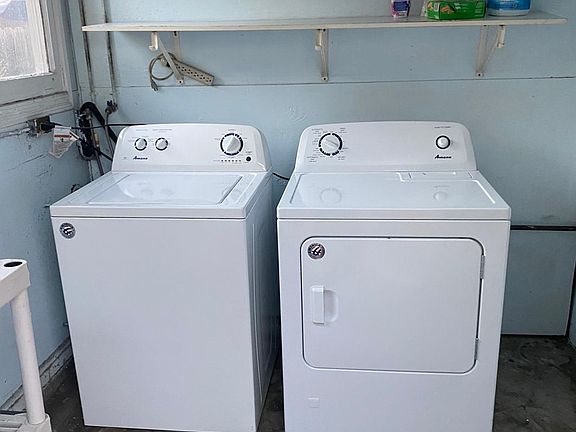 Washer and dryer included in private laundry room