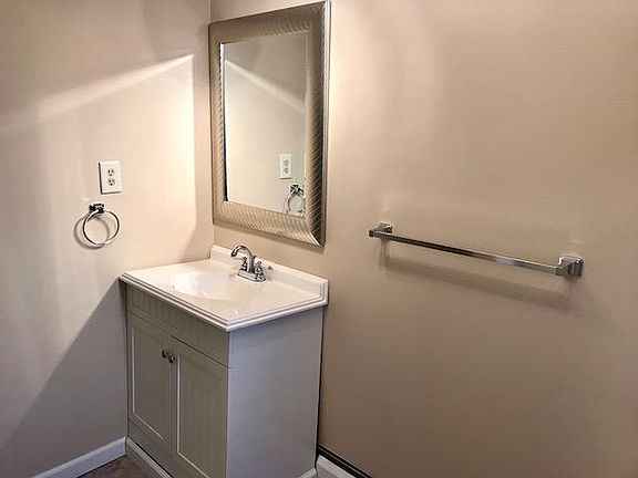 Bathroom, includes enclosed tub/shower
