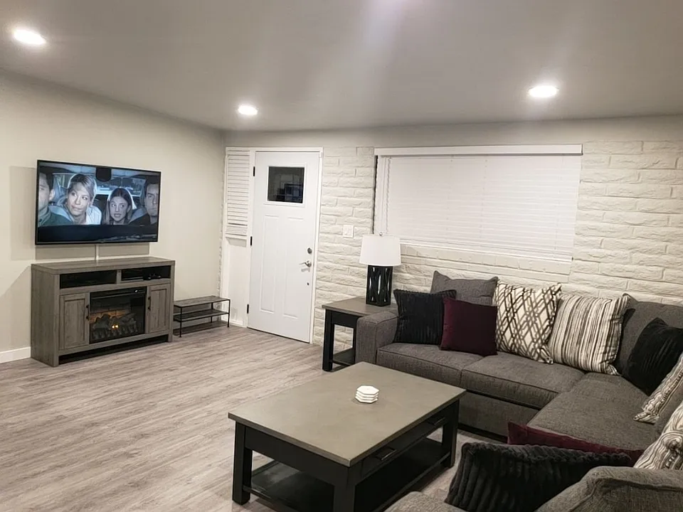 Spacious living room with 55 inch TV