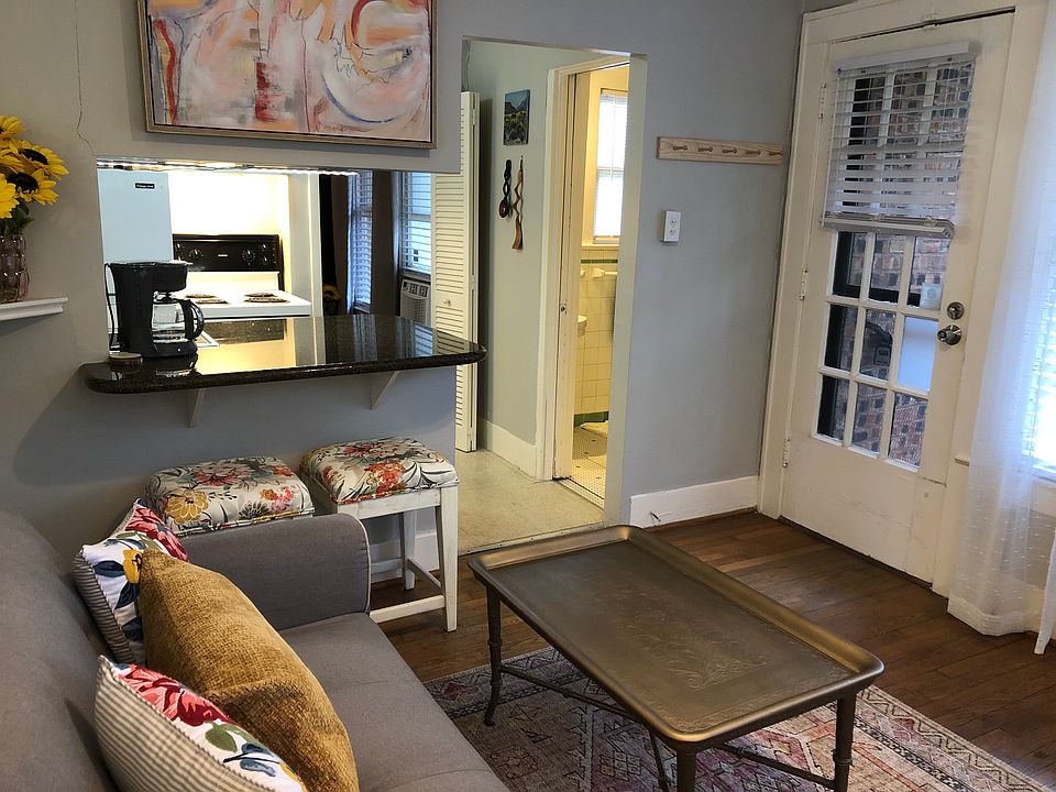 Cozy living space with desk, sleeper sofa, TV and breakfast bar