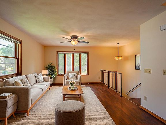 Main floor living area, virtually staged. Photo of comparable unit