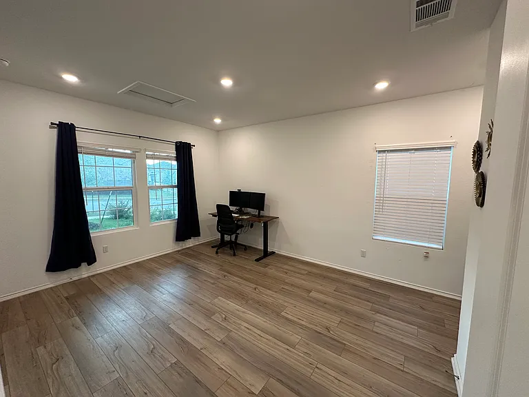 Large Downstairs separate office room with refrigerator. Can also be used as bedroom 5