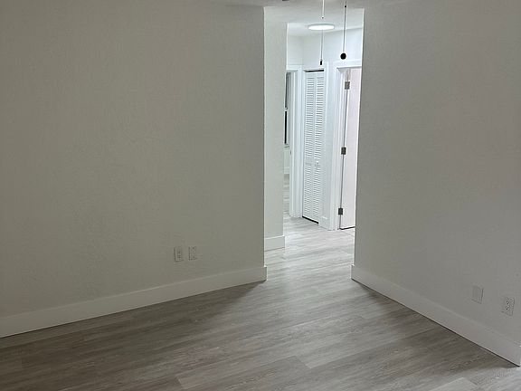 Livingroom area with modern fan.