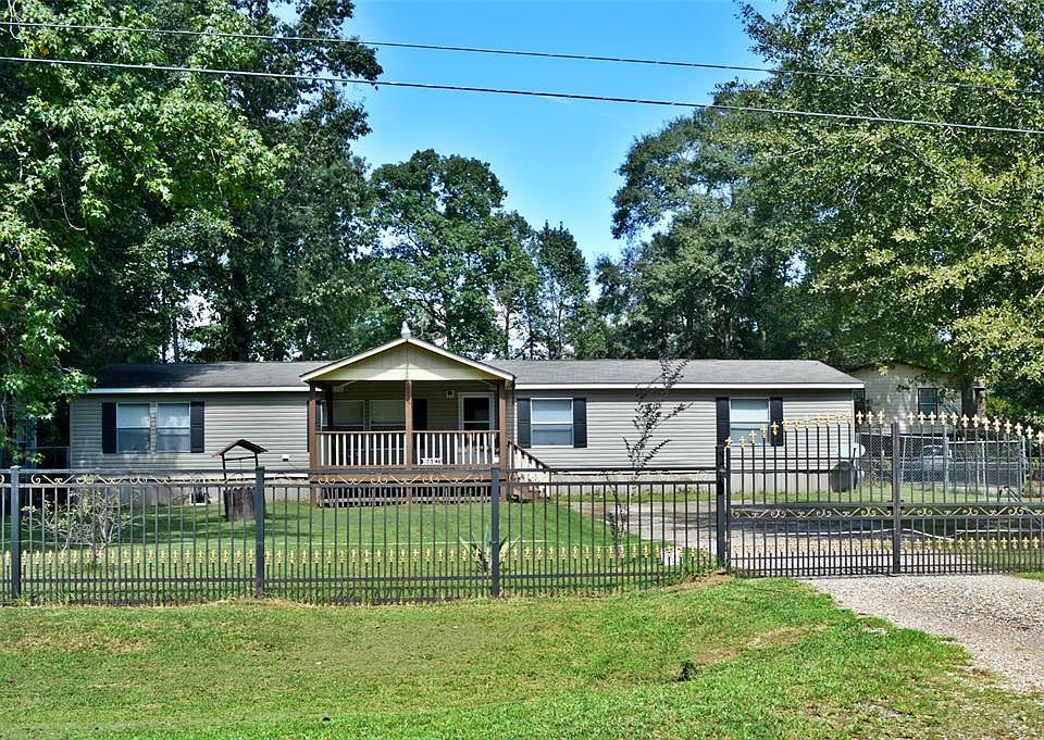 Front view, fully gated home with a nice size front porch.