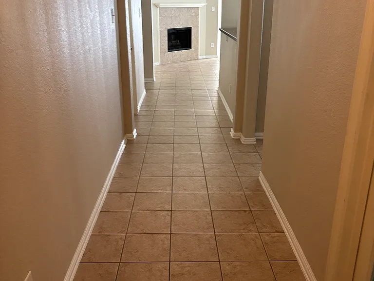 Standing at front door looking at gas fireplace. Ceramic tile