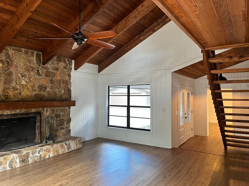 Great Room with fireplace & stair to Loft