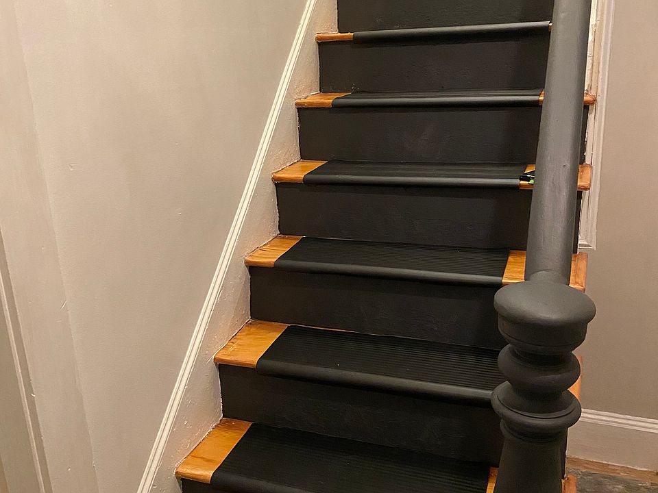 Private front entrance with mudroom area and stairs leading up to unit