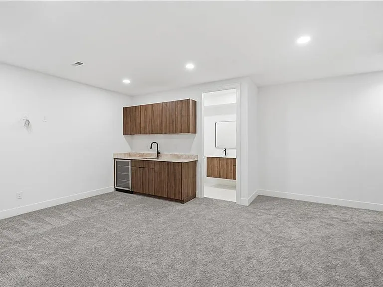 Basement media room and entry with full bathroom