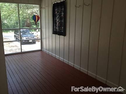 Pleasant Screened-in Breezeway
						:
						Between main house and garage. Has screen door that goes out onto back deck.