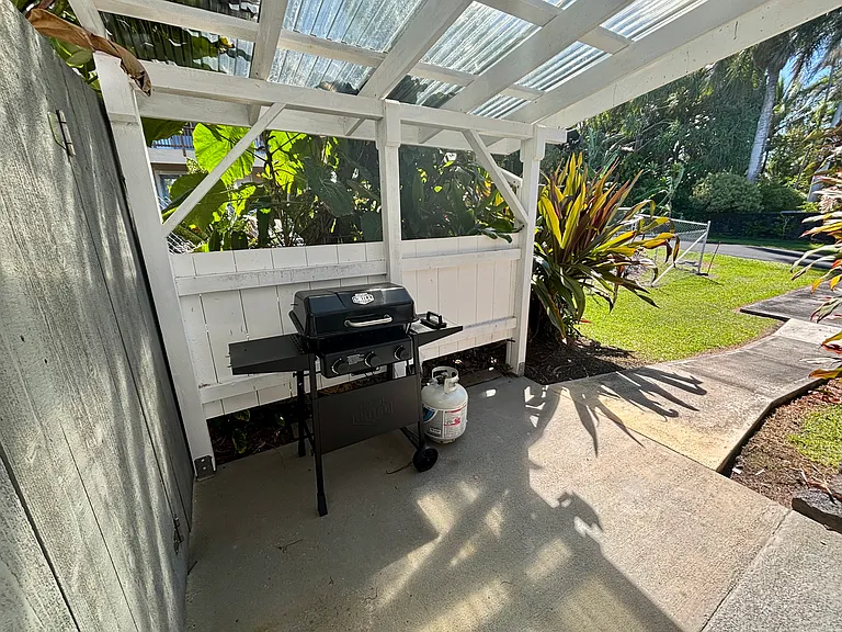 Private covered entry with BBQ