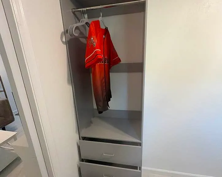 Closet with 3 drawers.