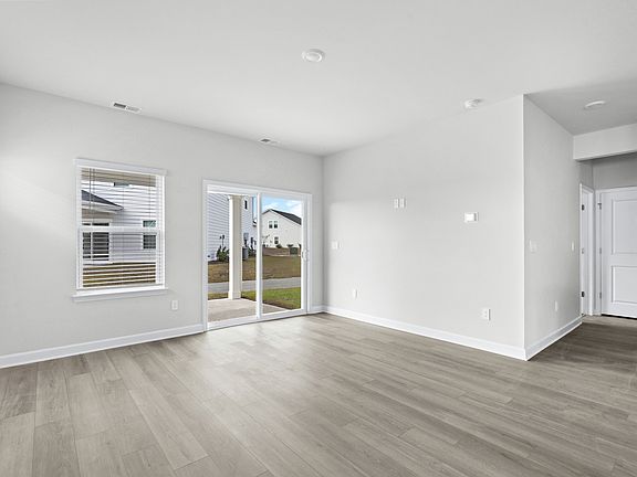 The great room comes with plenty of space that is great for hosting or relaxing with family.