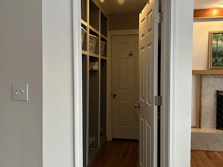 mudroom with 4 cubbies and extra storage off the attached 2 car garage