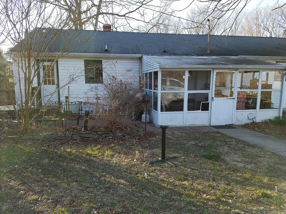 Back of the house - the porch is now missing the door. :-(