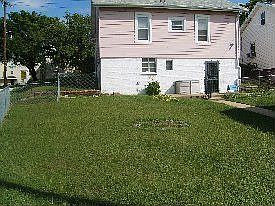 Rear of house w/fenced in yard