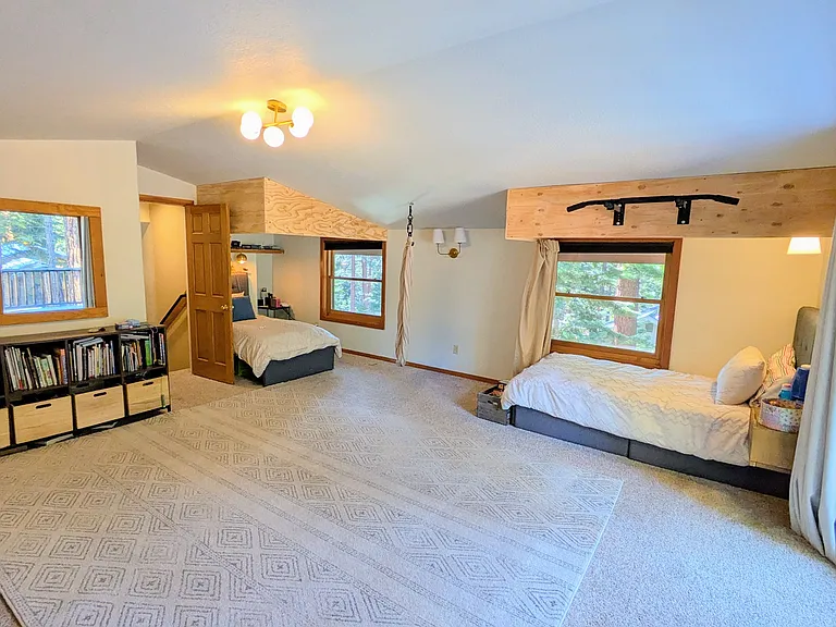 Second large upstairs room is currently set up with 3 private twin beds, each with a blackout privacy curtain