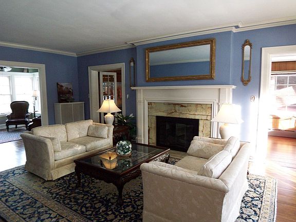 Gorgeous living room with wood burning fireplace, wood floors 