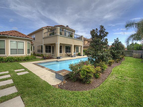Custom Executive home in elegant gated community. Easy to maintain stucco exterior with clay tile ro