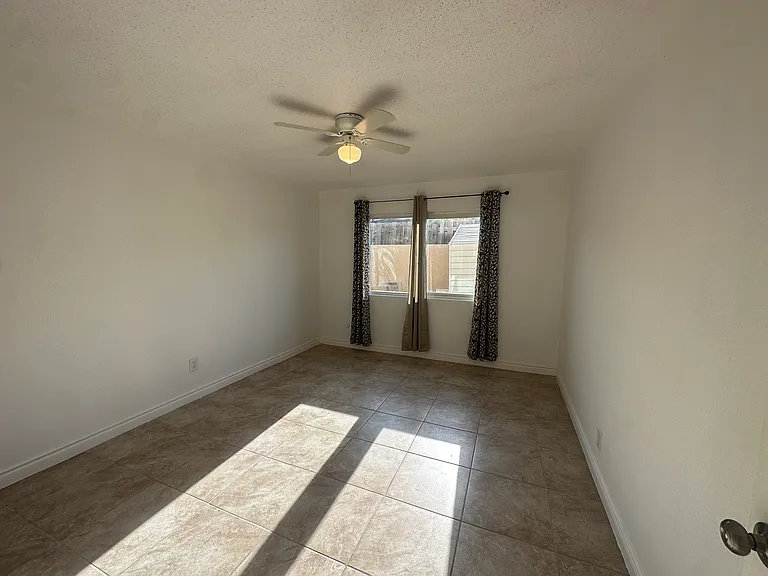 larger bedroom window side