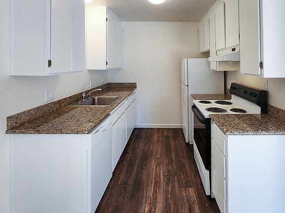 Granite counter tops, laminate wood flooring and plenty of storage.